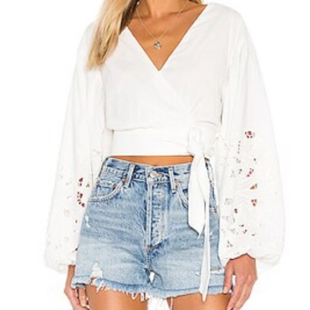 Beautiful cropped wrap top with dramatic eyelet sleeves